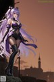 A woman with long purple hair standing on top of a building.