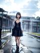 A woman in a black dress holding an umbrella in the rain.