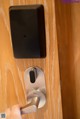 A person is opening a door with a smart lock.