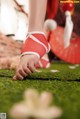 A close up of a person's hand on the grass.