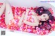 A woman laying in a bathtub covered in rose petals.