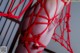 A close up of a woman's butt in a red net.